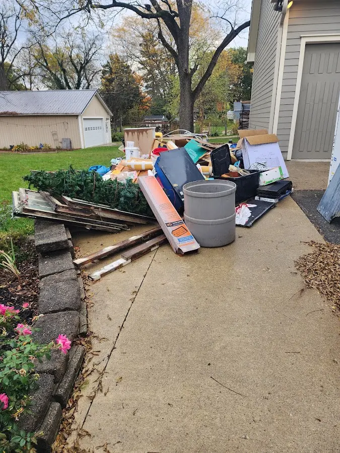 Dumpster being loaded with debris for Residential Dumpster Rental in Merrifield